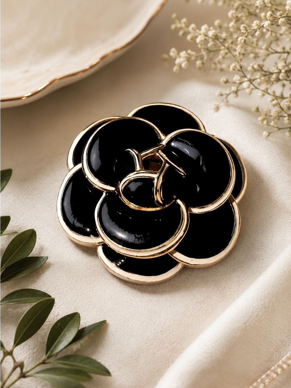 Black Enamel Camellia Brooch with Gold Trim and White Accents